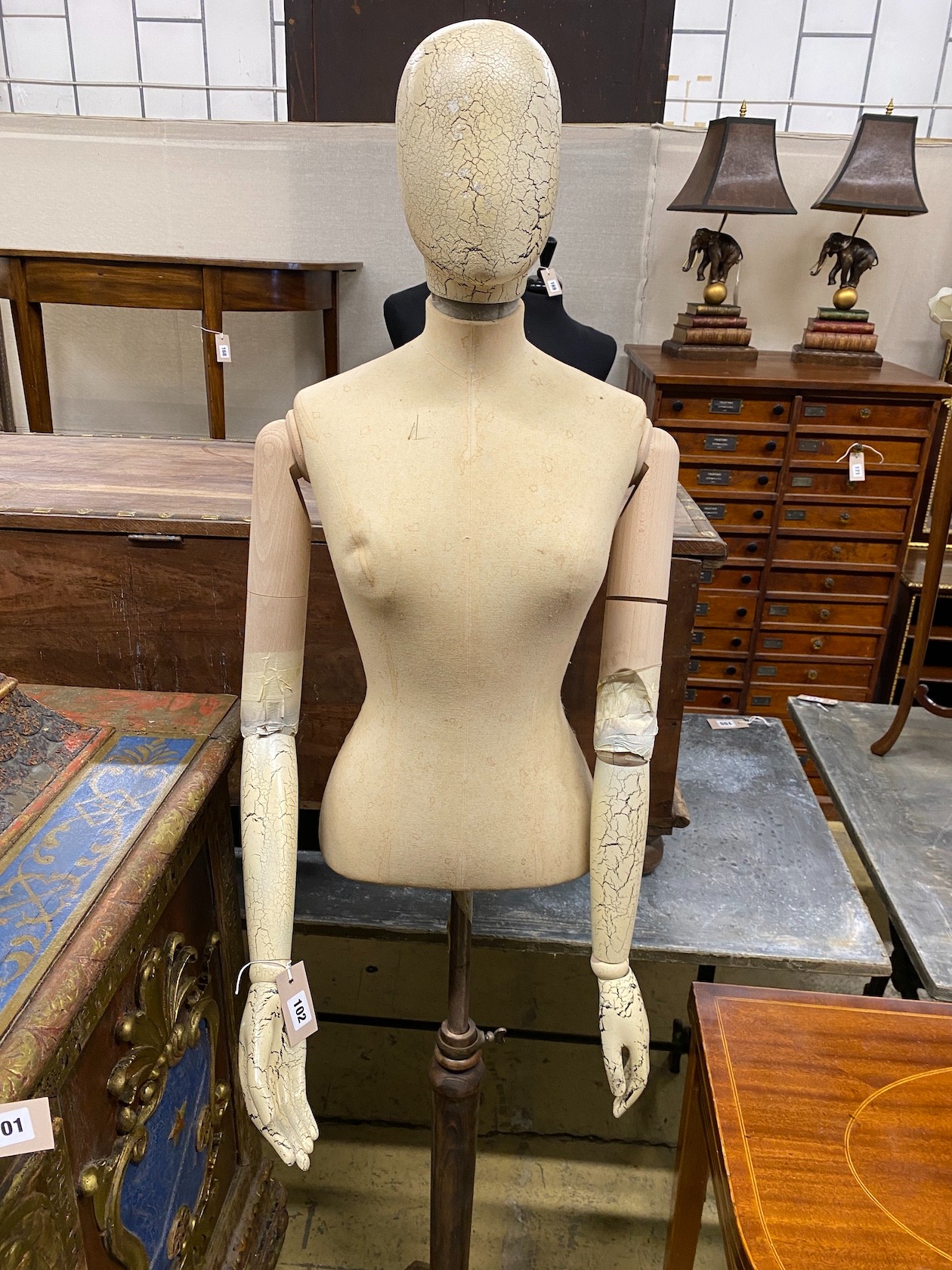 A Victorian style canvas, beech and composition mannequin on telescopic stand